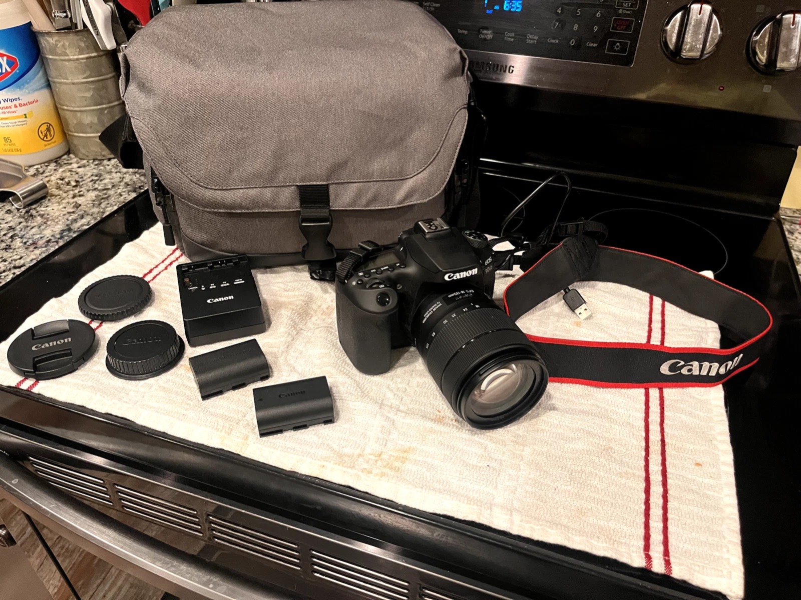 Canon EOS 90D DSLR Camera (Black) with Canon 18–135mm Lens, Charger & 2× Battery Extenders - Image 1